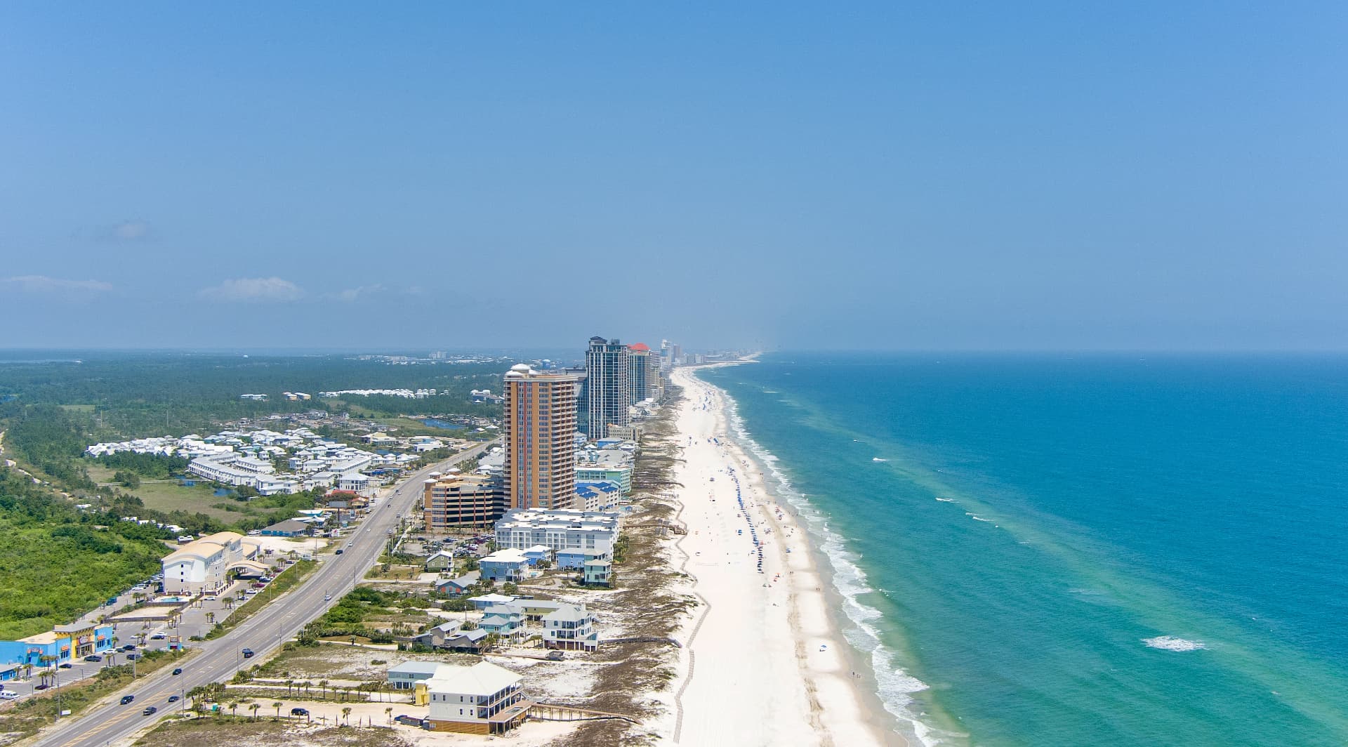 Aerial view of the white sand beach, condos and turquoise Gulf water at Gulf Shores, Alabama