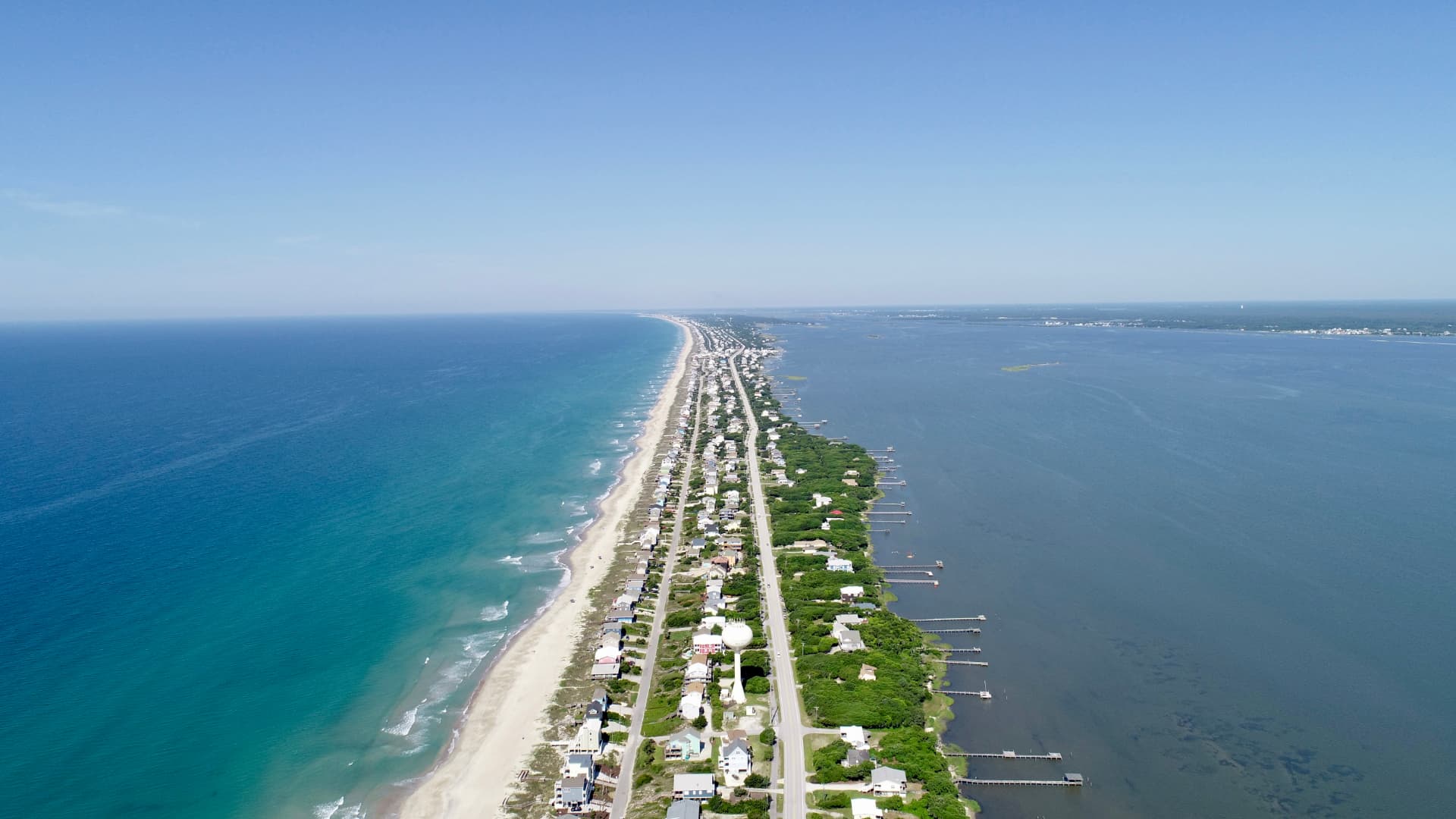 Aerial view of the beach, homes and sound side docks along Emerald Isle, North Carolina