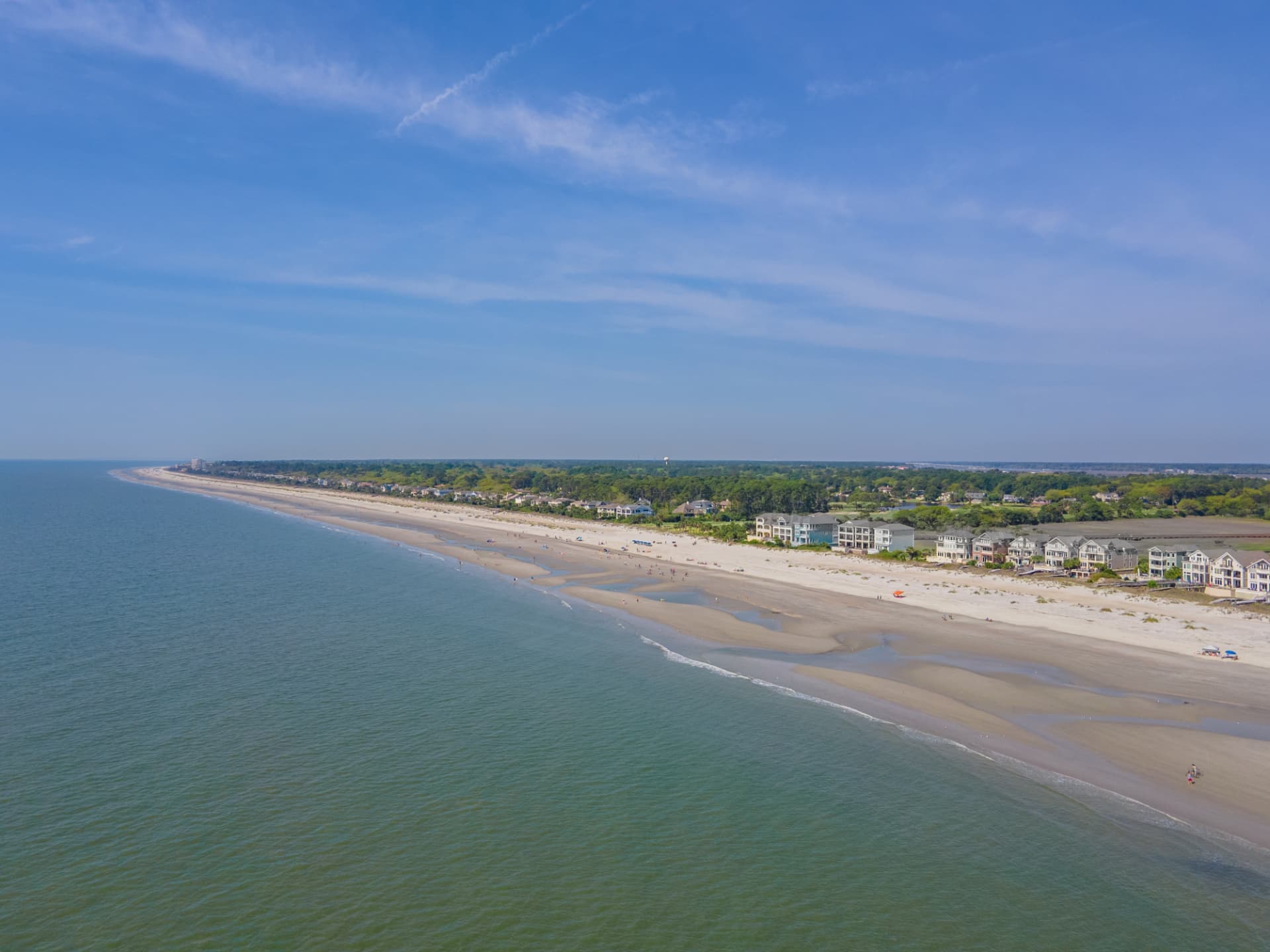 Aerial view of the wide beach and oceanfront homes along Hilton Head Island, South Carolina