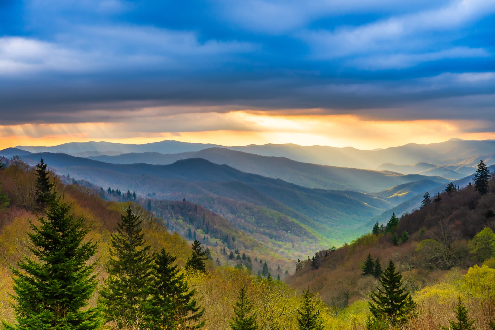 Sunbeams over the layered blue ridges and green valleys of the Great Smoky Mountains, Tennessee